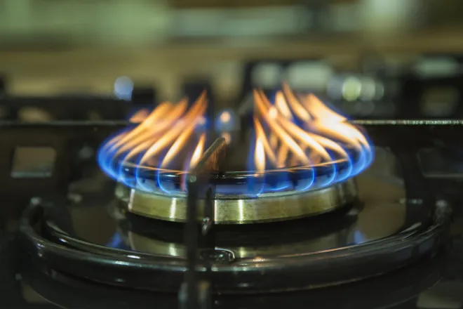 Gas burner with flames.