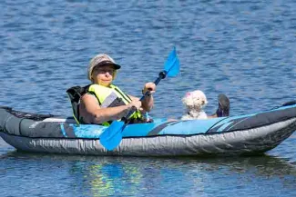 PICT Woman in inflatable paddle boat - CPW
