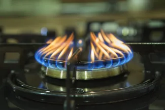 Gas burner with flames.